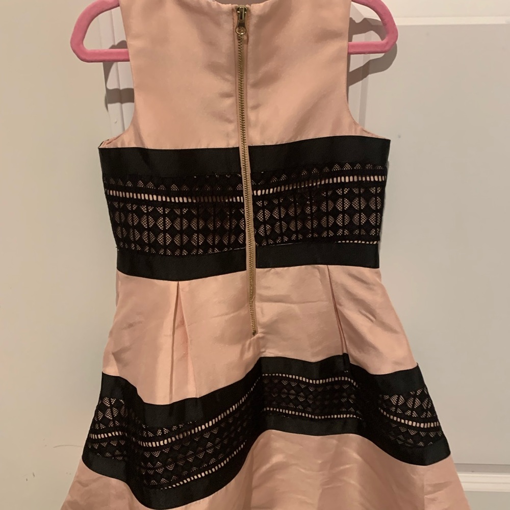 Pink dress with black lace.